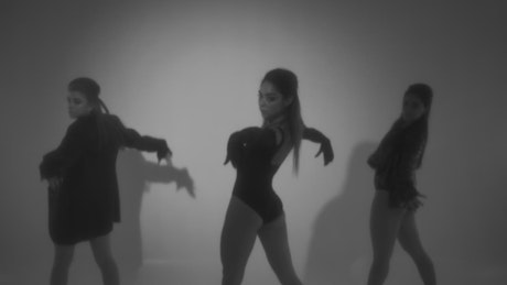 Choreography of three girls in black and white
