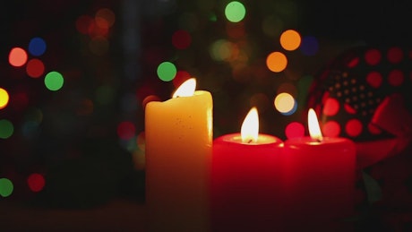 Christmas candles and a bokeh in the background.