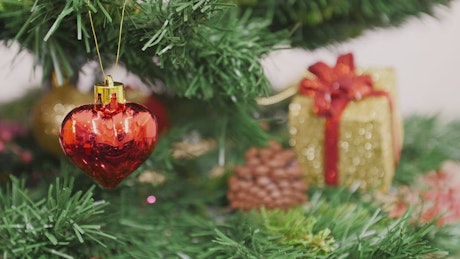 Christmas decorations on a plastic tree.