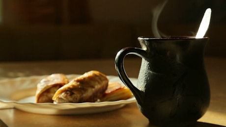 Cinemagraph of steaming cup of tea and sweats.