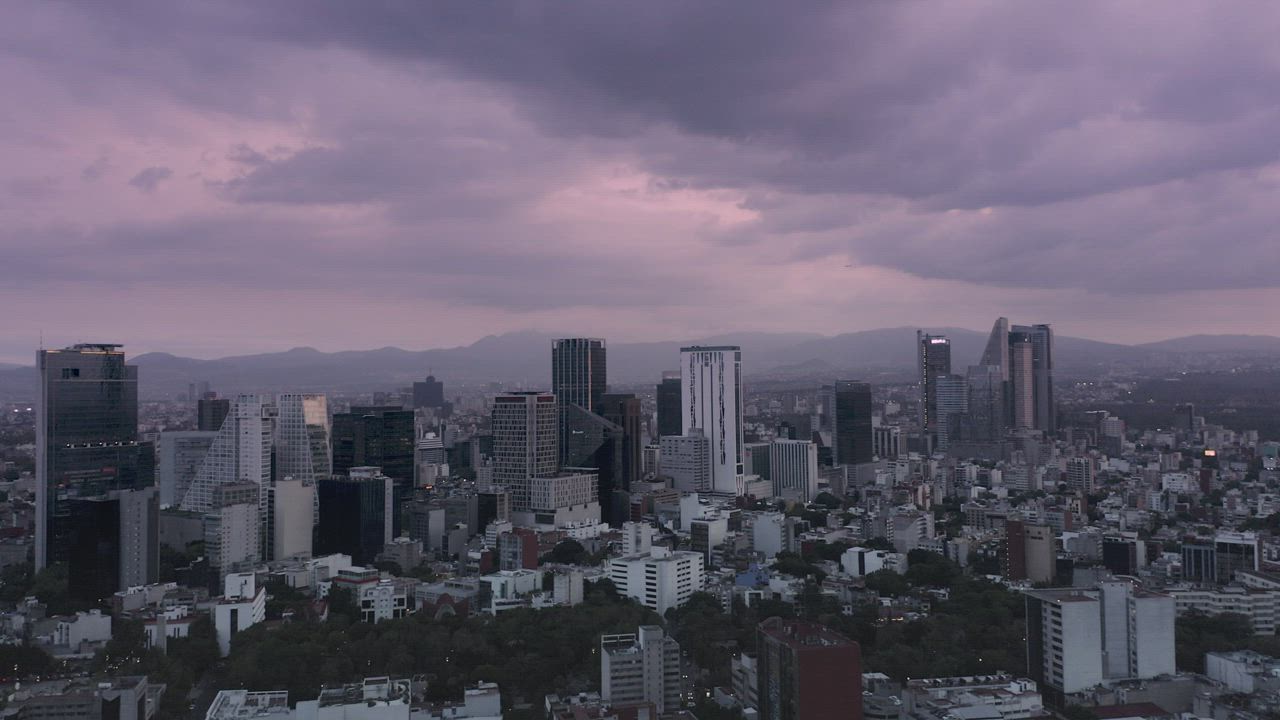 City buildings on cloudy day Free Stock Video Mixkit