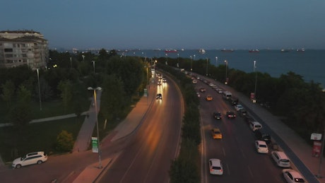 City traffic during the dusk near the seashore