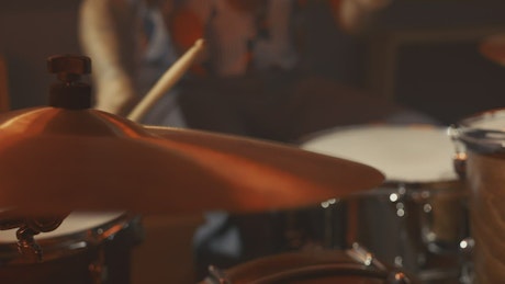Close shot of a drummer in a recording studio