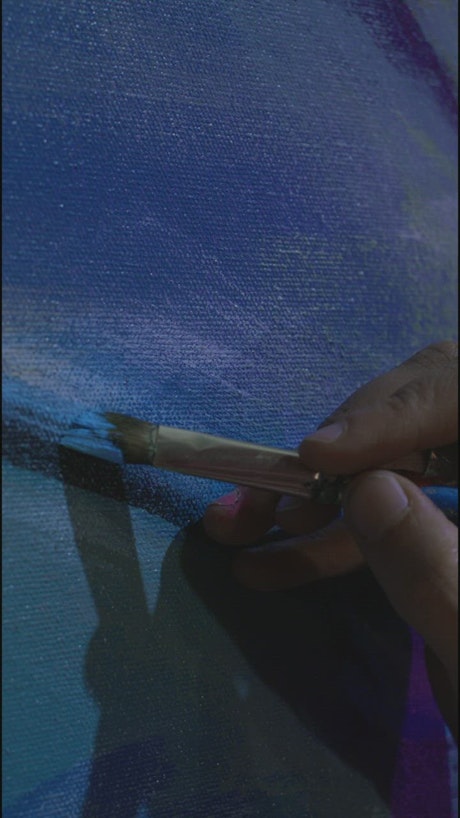 Close shot of an artist's hand painting