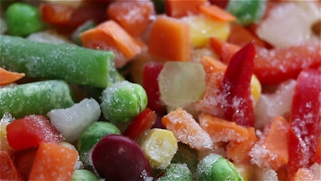 Close up of a colourful mix of frozen vegetables.