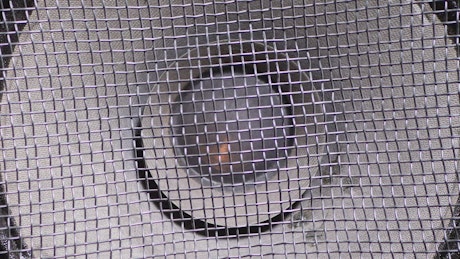 Close up of a speaker vibrating