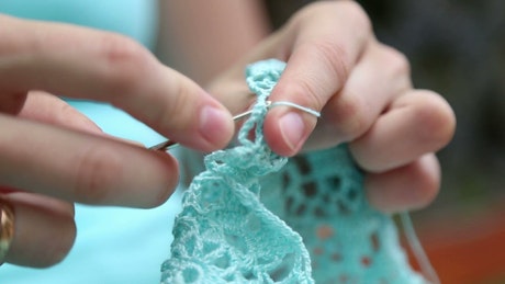 Close up of a woman crochet.