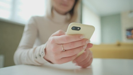 Close up of a woman using a smartphone.