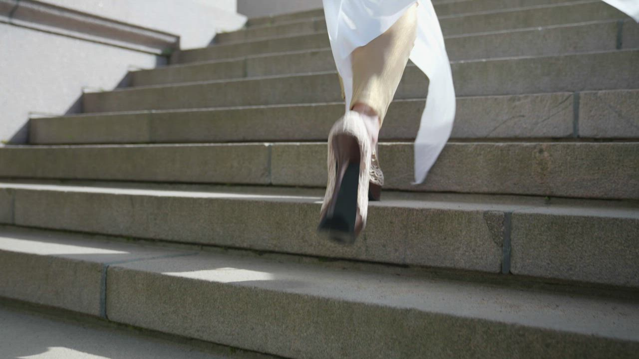 mixkit close up of a woman wearing high heels running up 49513 4