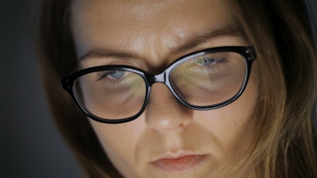 Close up of a woman's face with glasses