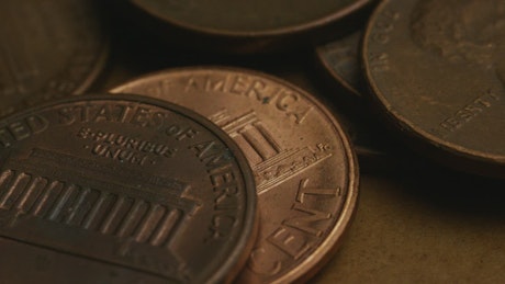 Close up of American pennies rotating.