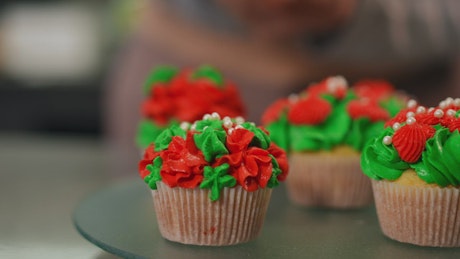 Close up of cupcakes decorated for Christmas.