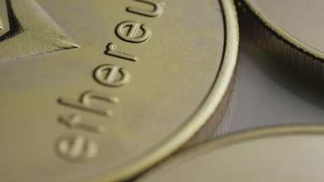 Close-up shot of slow rotating golden coins