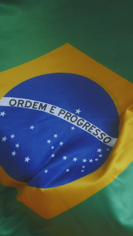 Close up view of a Brazilian flag.