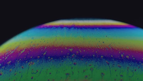 Close up view of a colorful soap bubble.