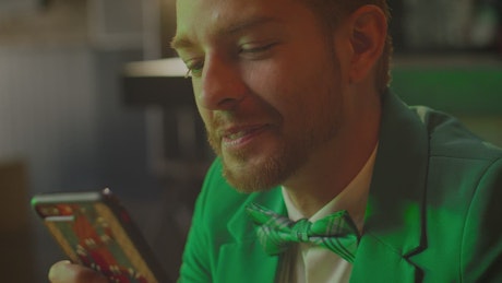 Close-up view of a man in a bar on St. Patrick's Day..