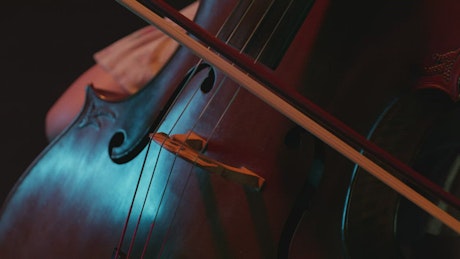 Close view of a woman playing the cello.