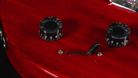 Closeup of a red guitar
