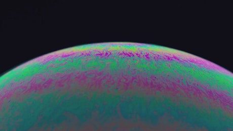 Colorful and abstract iridescent effect in a soap bubble.