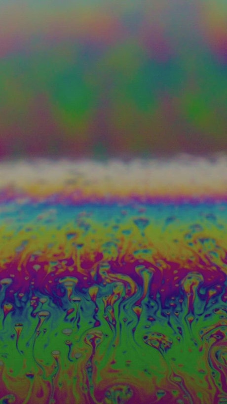 Colorful iridescent surface of a soap bubble.