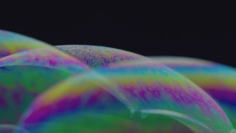 Colorful litmus effect in some soap bubbles.