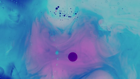 colorful texture of inks in a thick liquid.