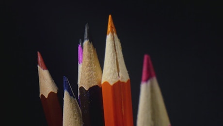 Colourful pencils on a black background.