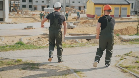 Construction workers with uniforms and security helmets.