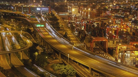 Container port and Hong Kong highway at night