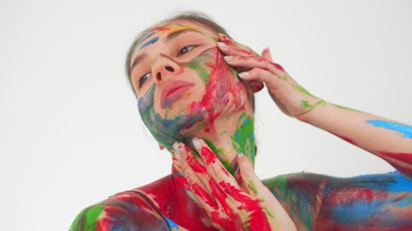 Contemporary dancer covered in bright body paint.