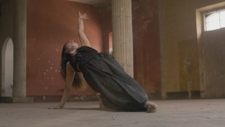 Contemporary dancer dancing on the floor.
