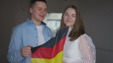Couple celebrating with a German Flag.