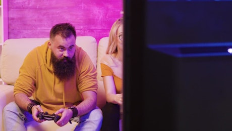 Couple playing video games together.