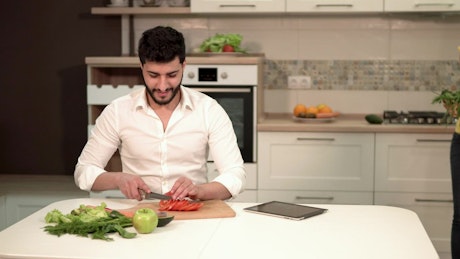 Couple preparing dinner with fresh groceries