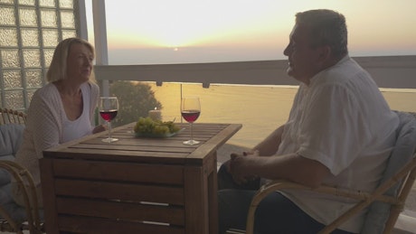 Couple sharing wine on holiday