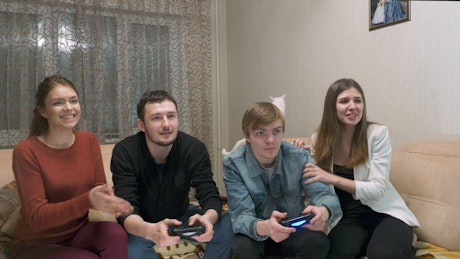 Couples playing a video game together