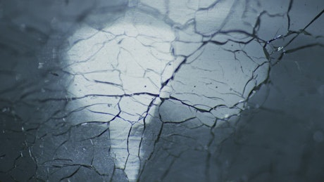 Cracked ice texture with light on the background