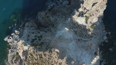 Crag in the sea, top aerial shot