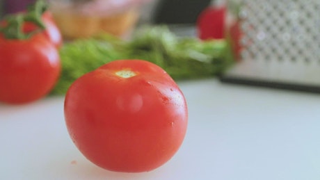 Cutting a tomato for a salad.