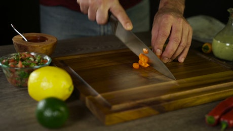 Cutting up an orange pepper