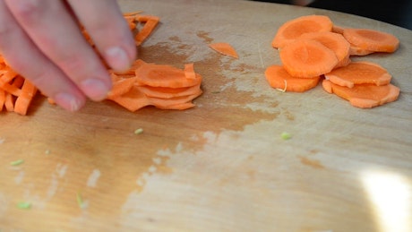 Cutting up carrots into small chunks