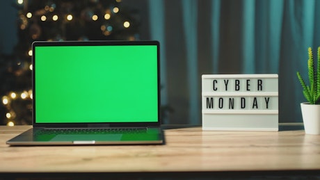 Cyber monday sign next to laptop ready for shopping.