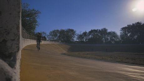 Cyclist riding a track in a park