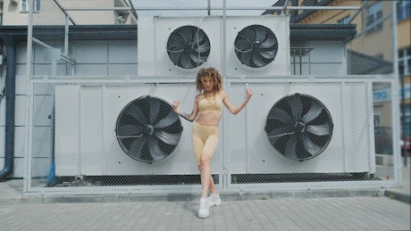 Dancer curly girl performing outdoors.
