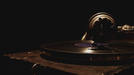 Dark room with antique vinyl record player.