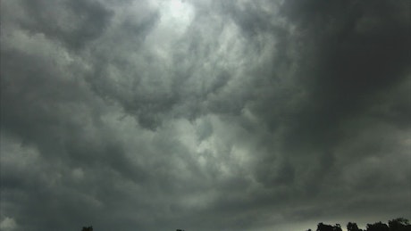 Dark storm clouds and rain.