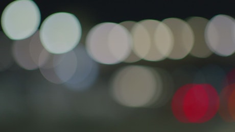 Defocused view of an avenue at night.