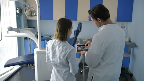 Dental staff using a tablet computer