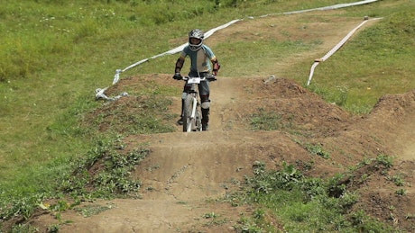 Dirt bike rider navigating a course.