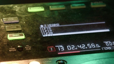 DJ mixer close up with RGB lights.